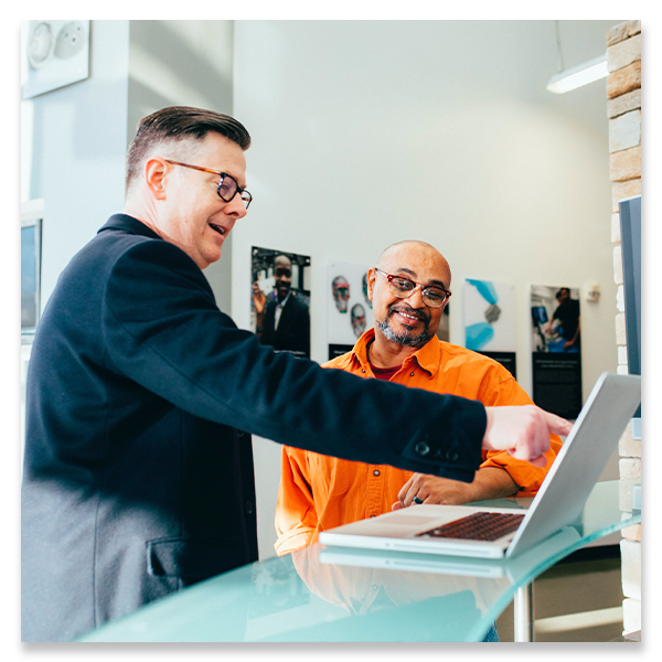 man pointing at computer